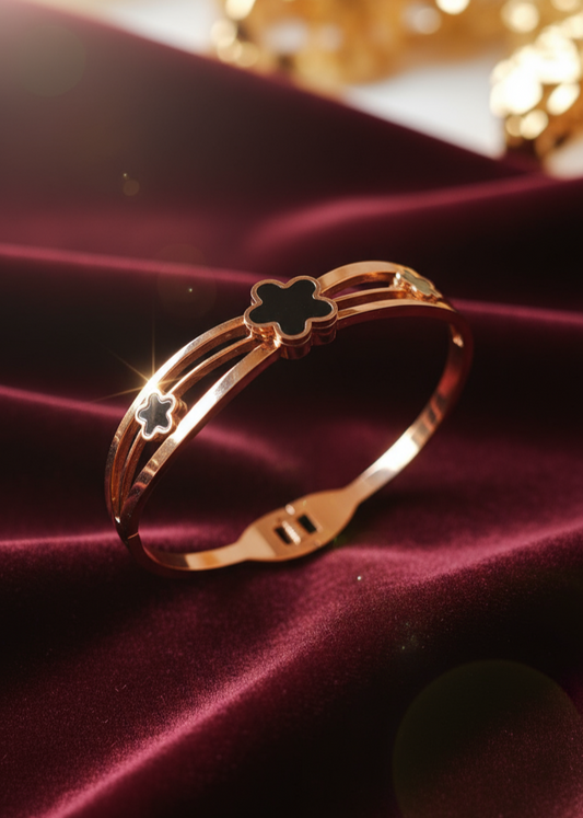 rose Gold bracelet with floral design on a red fabric background